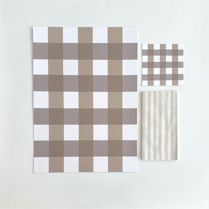 100% recyclable premium heavyweight paper placemats, coaster and compostable napkins. Picnic or party,  this gingham design is never going out of style. In chocolate shades with a matching striped napkin, this setting is a cool, neutral base for any sit down event.